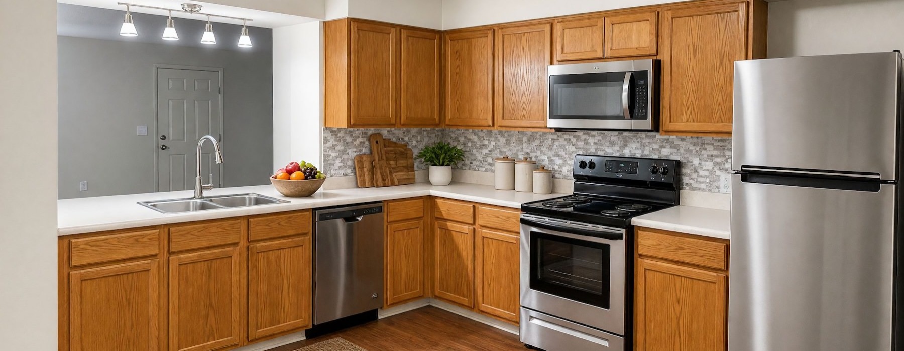 a kitchen with wooden cabinets