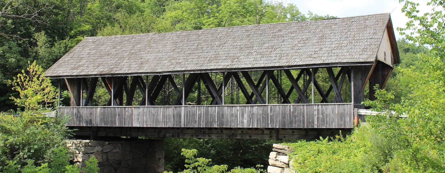 a wooden bridge over a river
